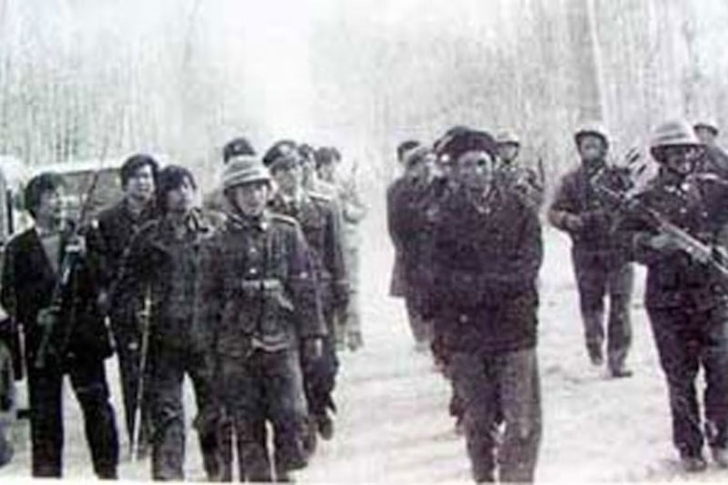 Uyghur farmers being rounded up by Chinese armed forces in Barin, 1990. (Undated RFA file photo)